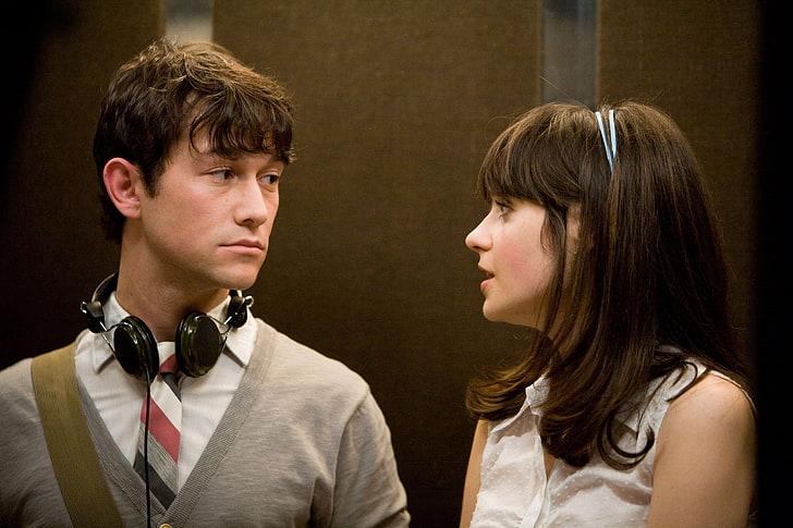 Tom and Summer in the elevator — headphones around his neck, her looking at him — Day 1 of the projection